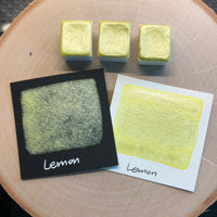 Lemon yellow watercolor paints half pan